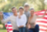 family-of-four-holding-an-american-flag.jpeg